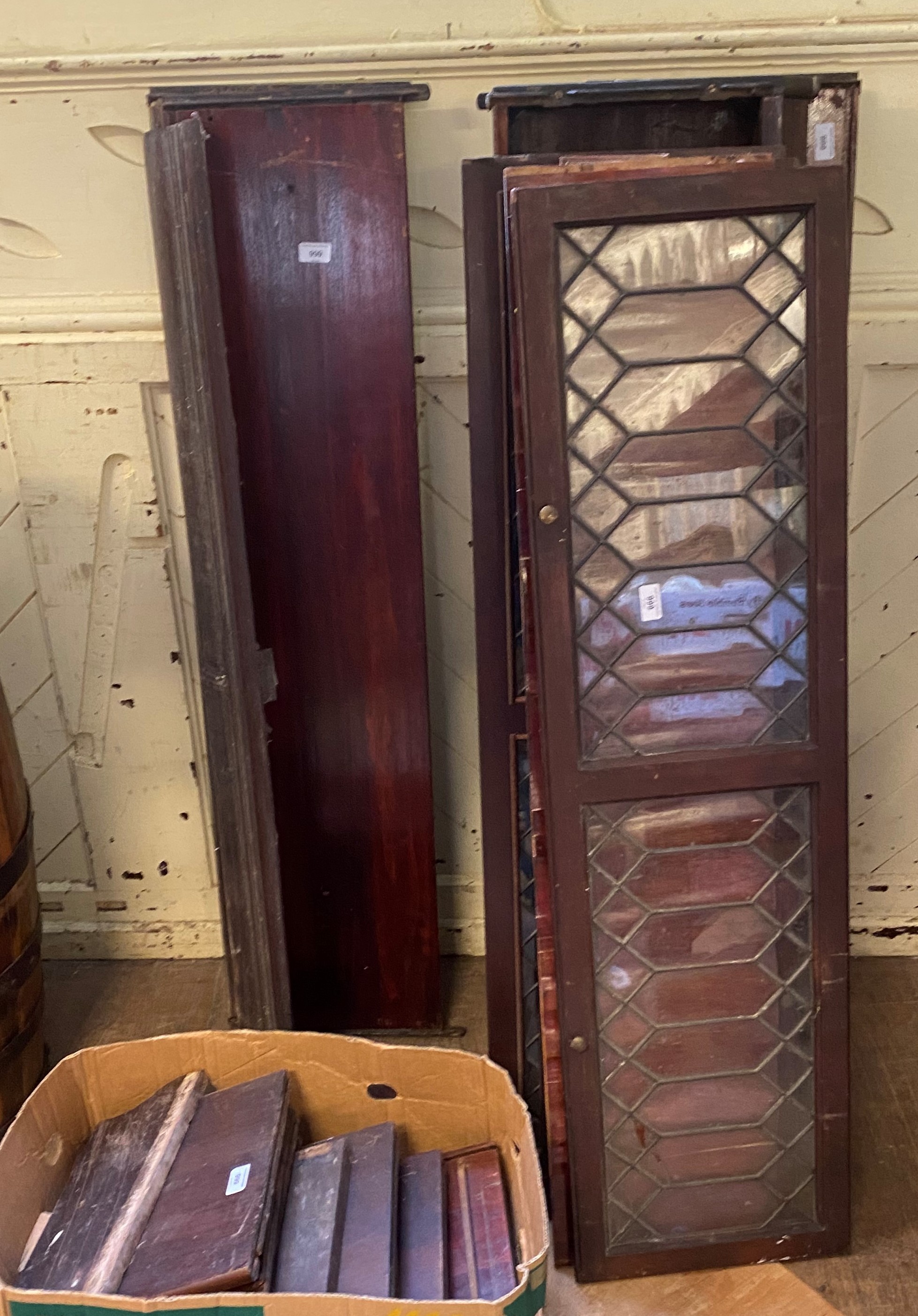 A mahogany four section Globe Wernicke style bookcase, with leaded glazed doors, 131 cm wide Various