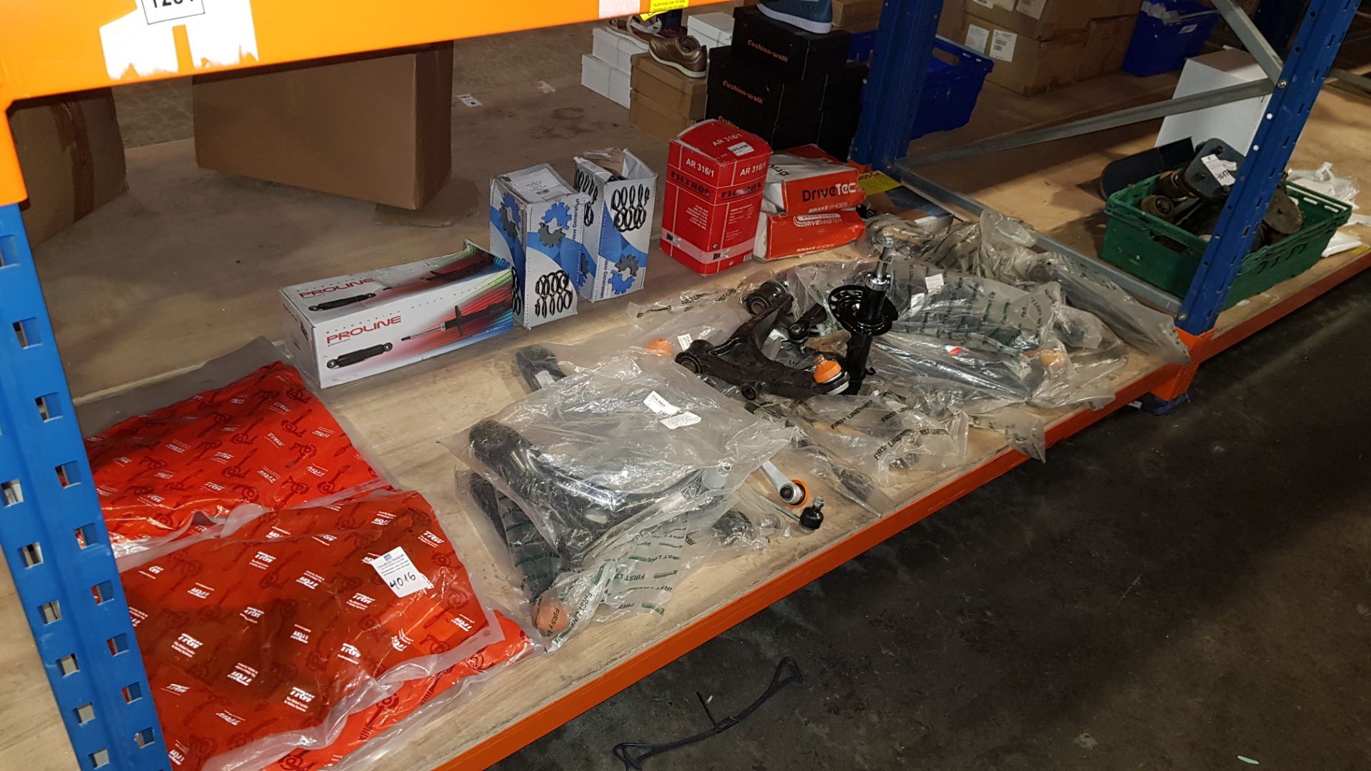 ASSORTED CAR PARTS CONTAINING SHOCK ABSORBERS, COIL SPRINGS, TRACK CONTROL ARMS, ETC - IN ONE BAY