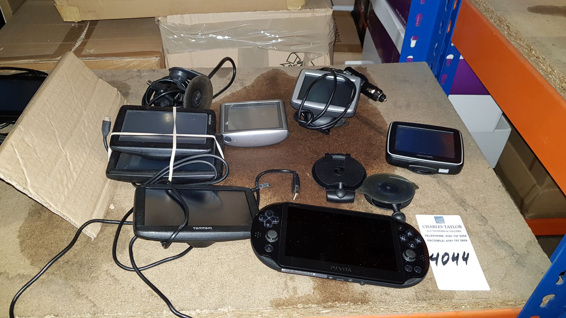 7 PIECE ASSORTED LOT CONTAINING 6 X TOMTOM SAT NAVS AND 1 X SONY PSVITA (PSP)