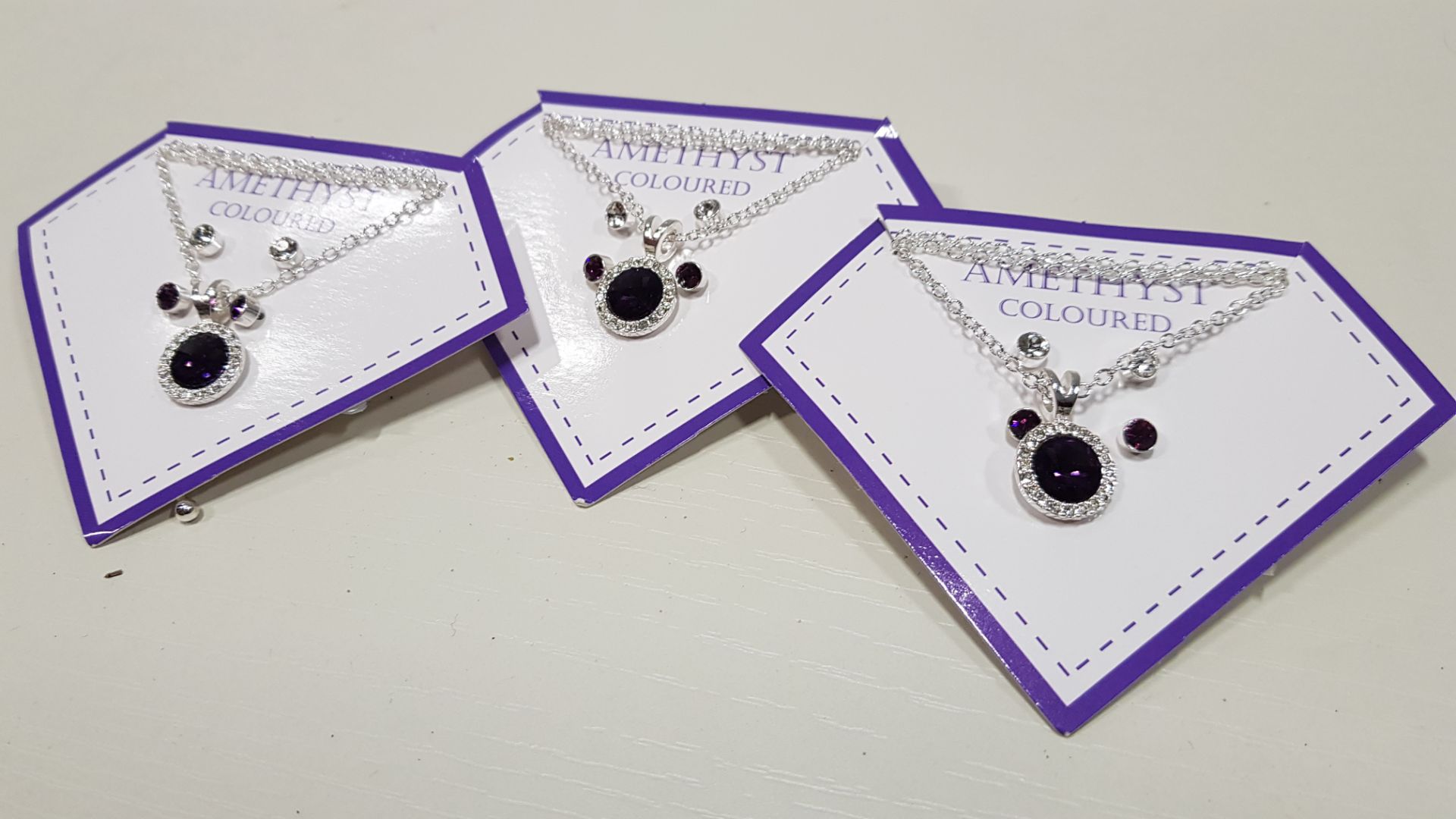 136 X BRAND NEW AVON NADYA 3 PIECE BIRTHSTONE GIFTSET - AMETHYST COLOURED 1 X NECKLACE AND 2 X PAIRS