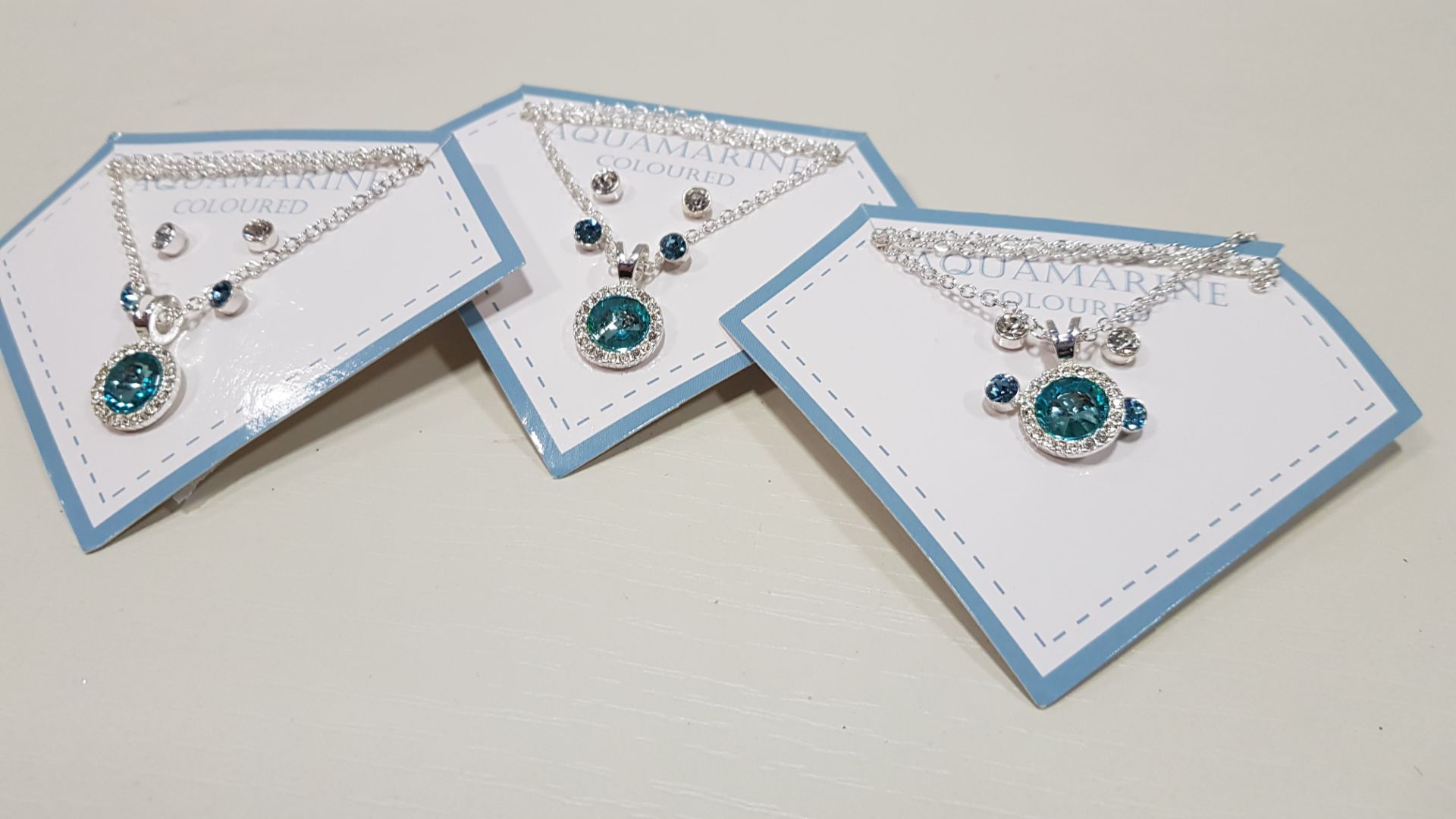 136 X BRAND NEW AVON NADYA 3 PIECE BIRTHSTONE GIFTSET AQUAMARINE COLOURED 1 X NECKLACE AND 2 X PAIRS