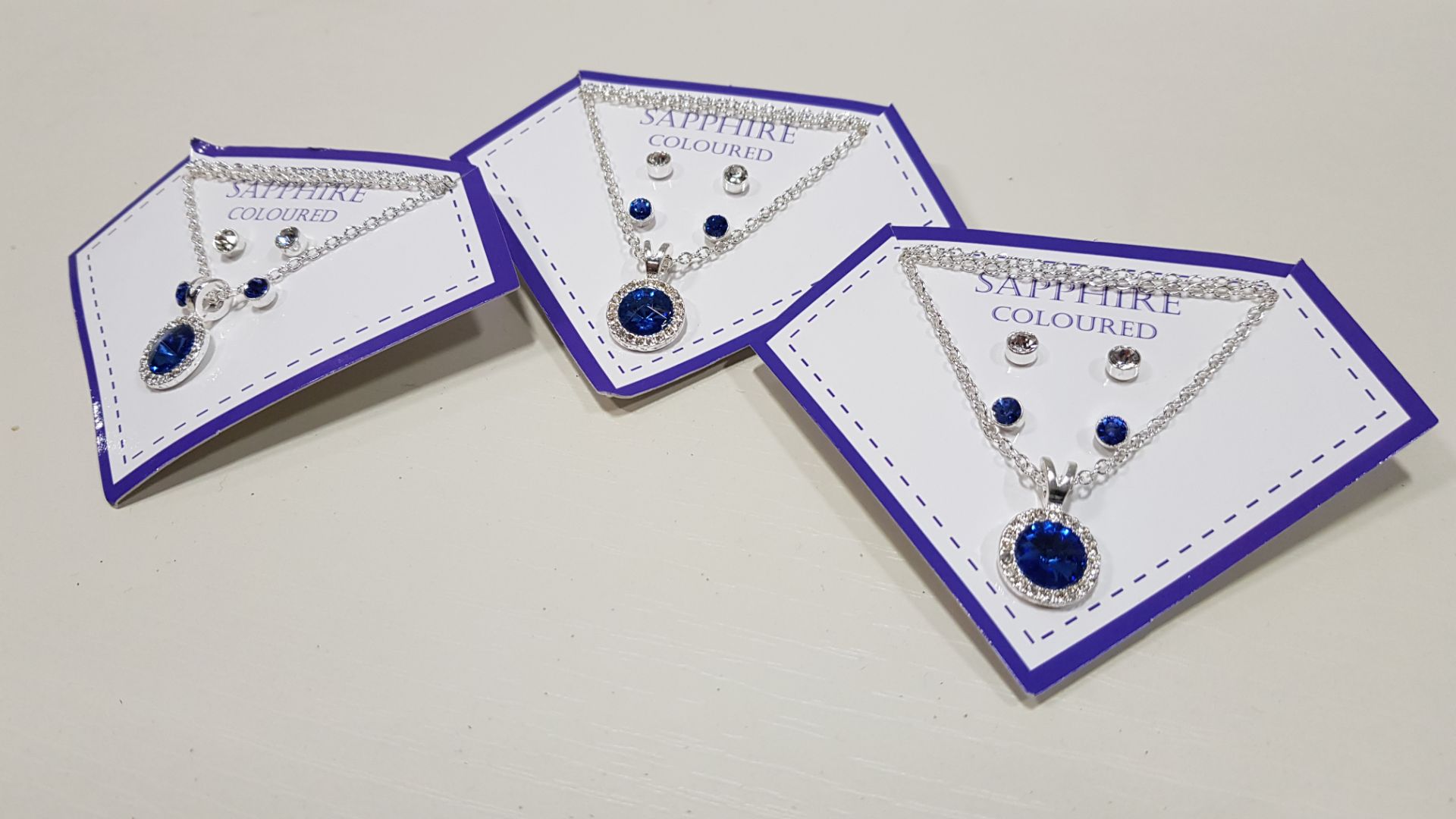 136 X BRAND NEW AVON NADYA 3 PIECE BIRTHSTONE GIFTSET - SAPPHIRE COLOURED 1 X NECKLACE AND 2 X PAIRS