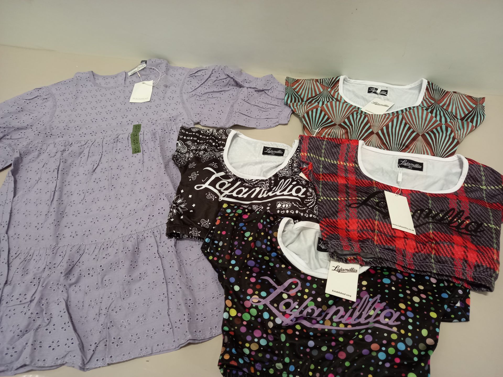 5 TRAYS (NOT INCLUDED) OF VARIOUS ITEMS OF CLOTHING IE LA FAMILIA SHIRTS, CHEQUERED PANTS AND