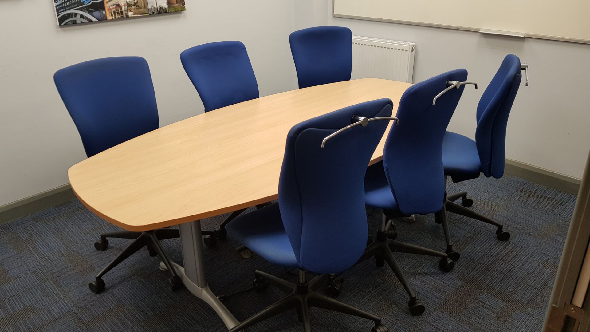 1 X LIGHTWOOD ELEPTICAL BOARDROOM TABLE, 6 X BLUE FABRIC OFFICE CHAIRS WITH CHROME COAT HANGER