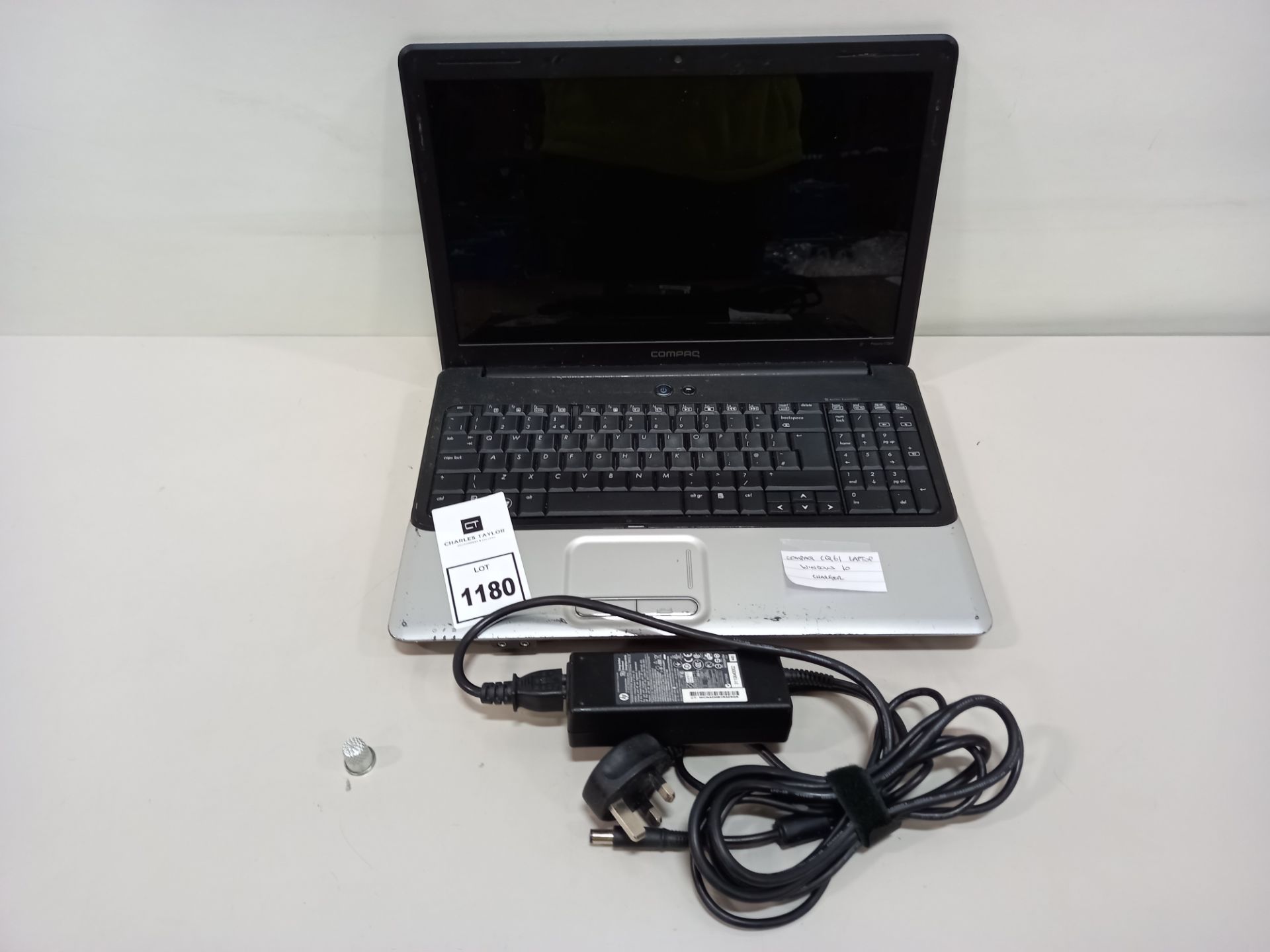 COMPAQ CQ61 LAPTOP WITH WINDOWS 10 AND CHARGER *NOTE: SCREEN JOINT TO LAPTOP DAMAGED*