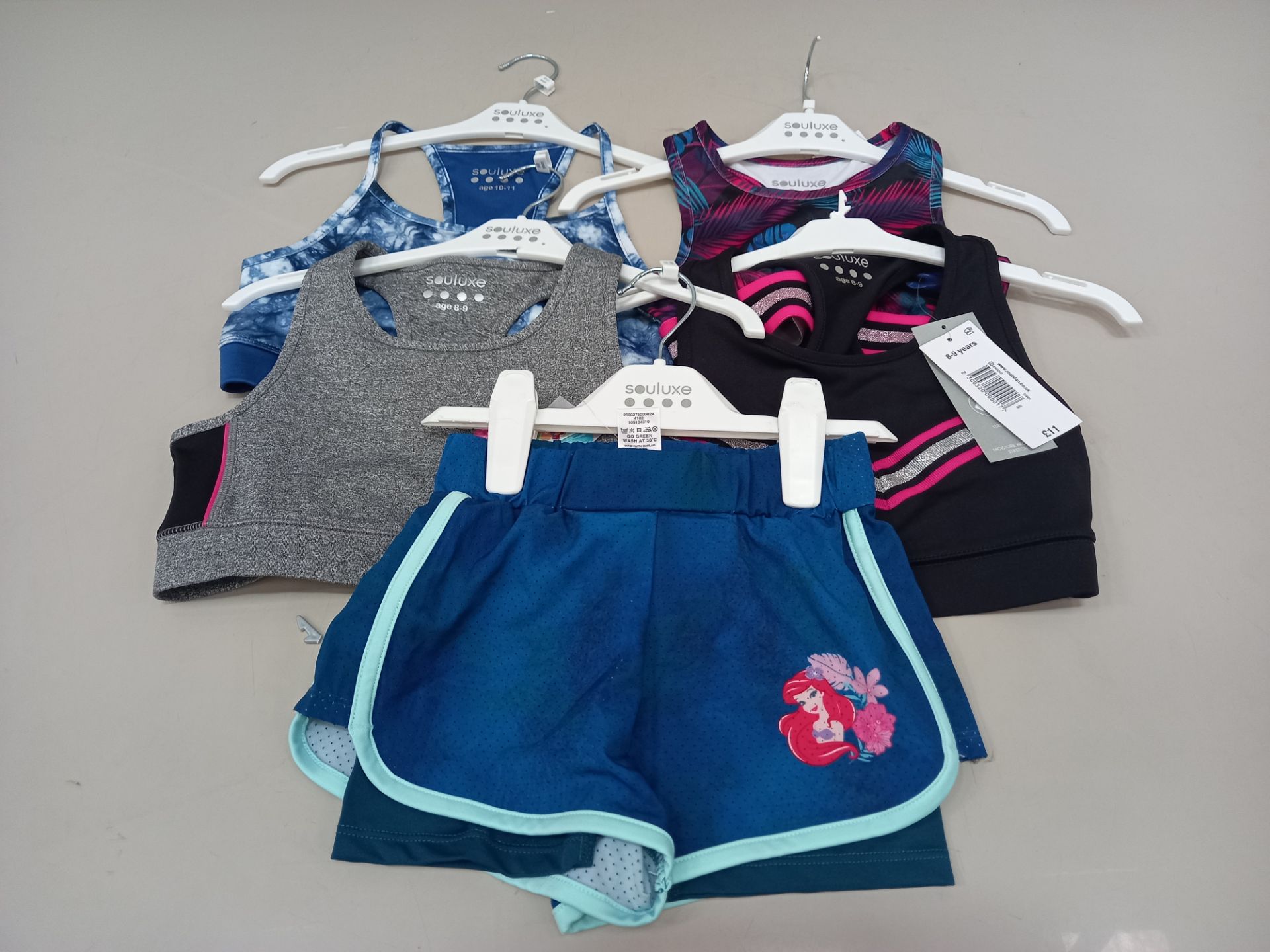 50 PIECE MIXED GYM/ SWIMIMING CLOTHING LOT CONTAINING VARIOUS GYM / SWIMMING TOPS IN VARIOUS COLOURS