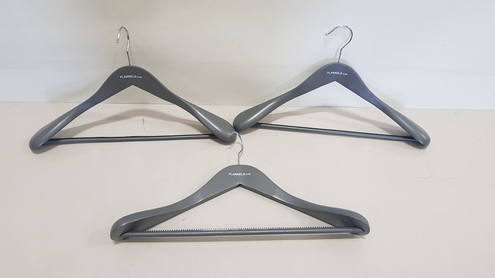 144 X BRAND NEW FLANNELS BRANDED COAT HANGERS WITH GRIPPED TROUSER BAR (IN 4 CARTONS) - (EBAY