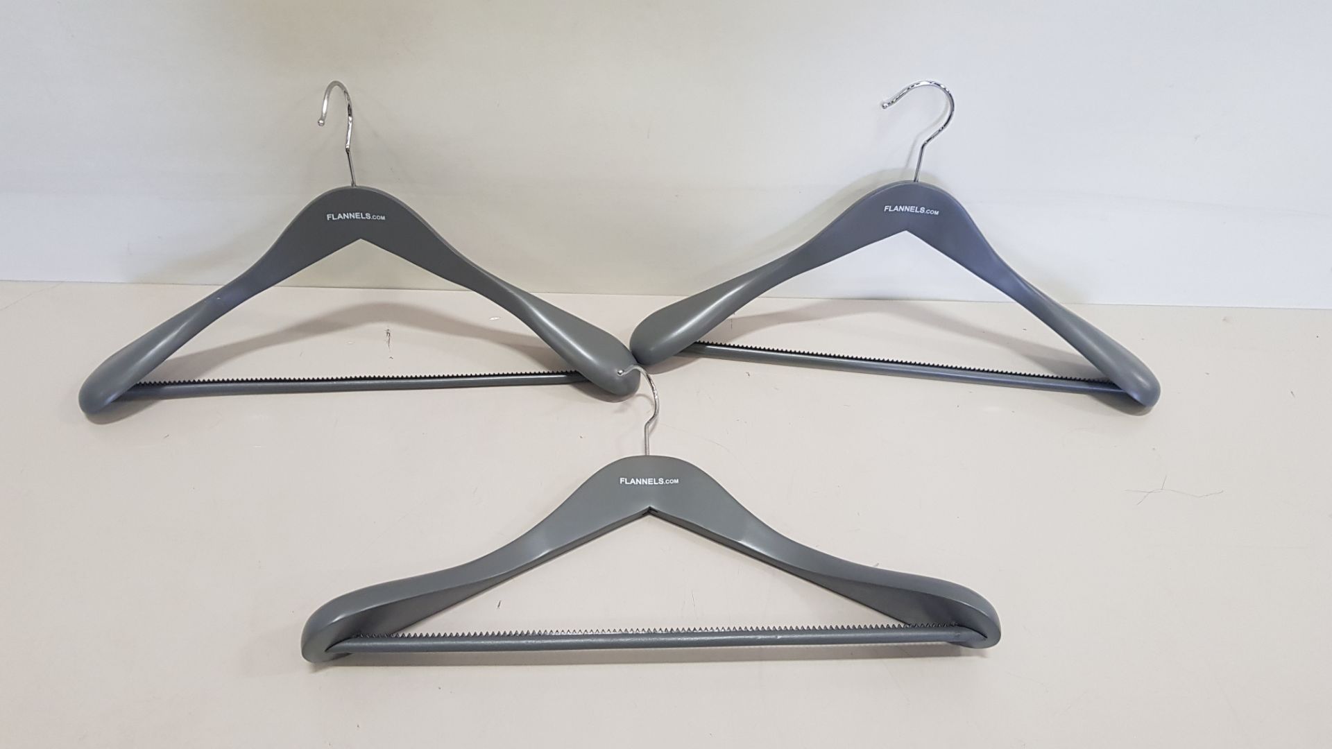 144 X BRAND NEW FLANNELS BRANDED COAT HANGERS WITH GRIPPED TROUSER BAR (IN 4 CARTONS) - (EBAY