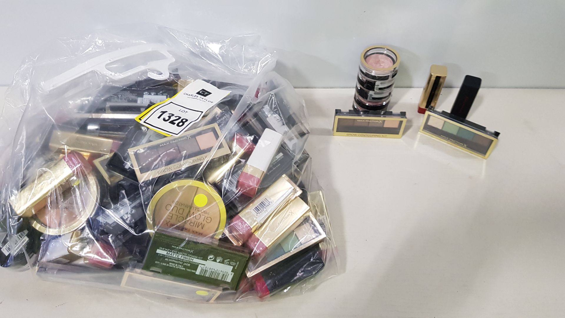 150 PIECE ASSORTED MAX FACTOR LOT CONTAINING CHERRY KISS (70) LIPSTICK, CRÈME PUFF BLUSH, BROW