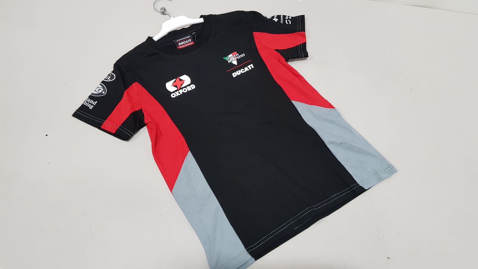 15 X BRAND NEW OFFICIAL DUCATTI MERCHANDISE TEAM DUCATTI SPONSORED T SHIRTS IN SIZE 9-11 YEARS