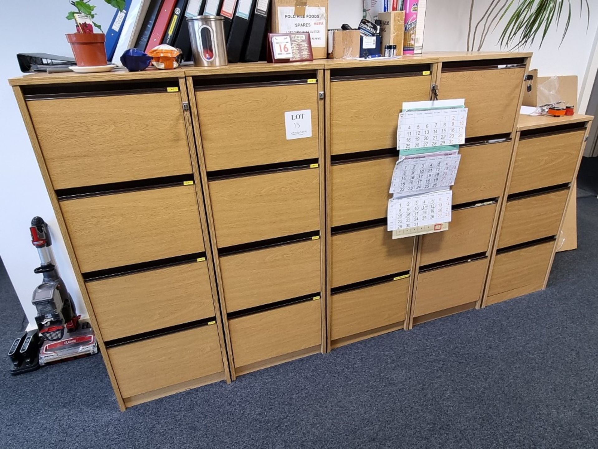 4 - four drawer wooden filing cabinets and 1 - three drawer filing cabinet