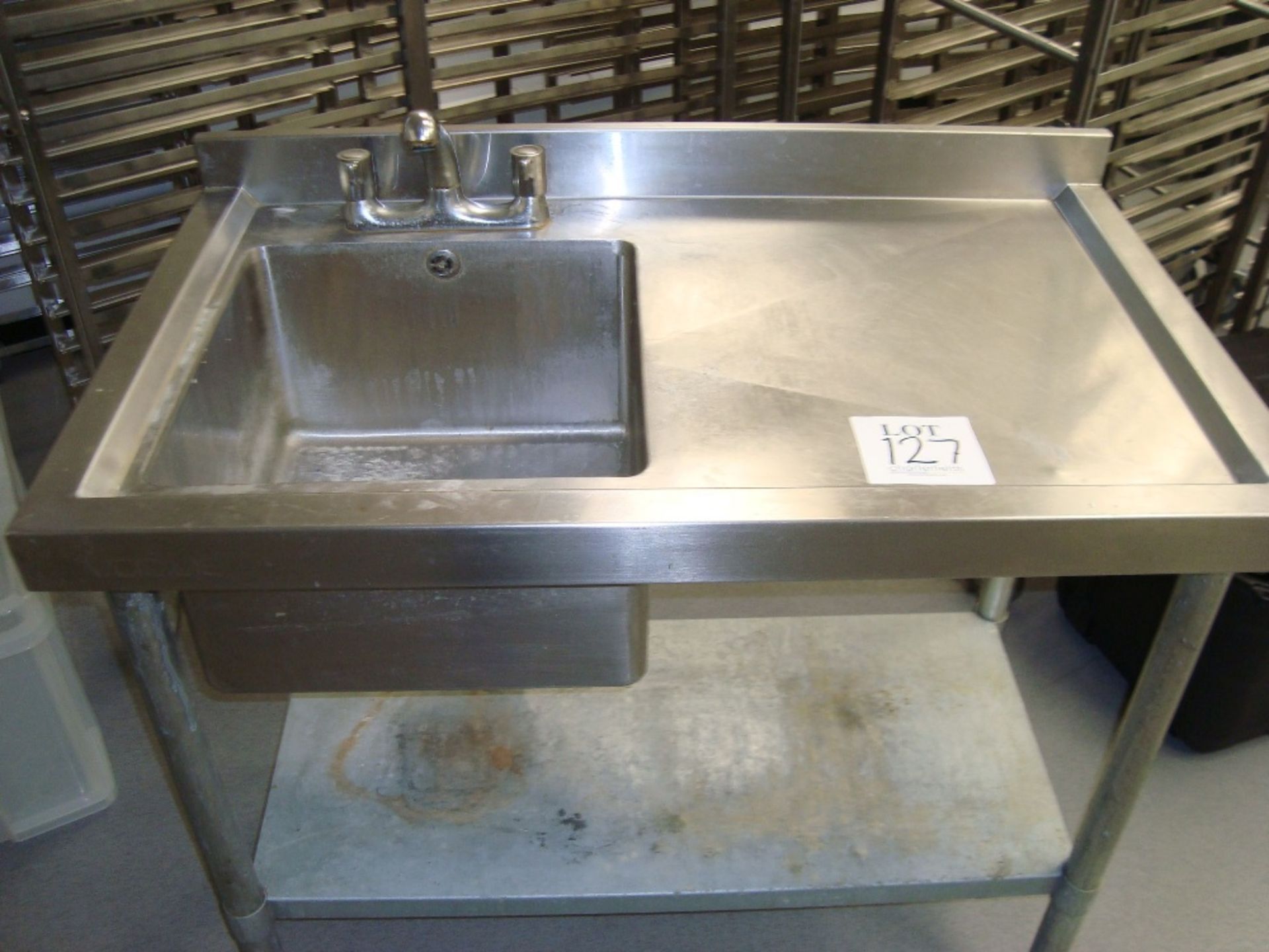 A Vogue stainless steel single deep bowl single drainer sink