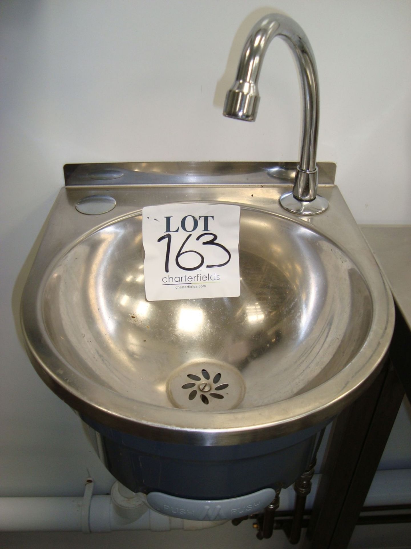 A stainless steel hand wash basin