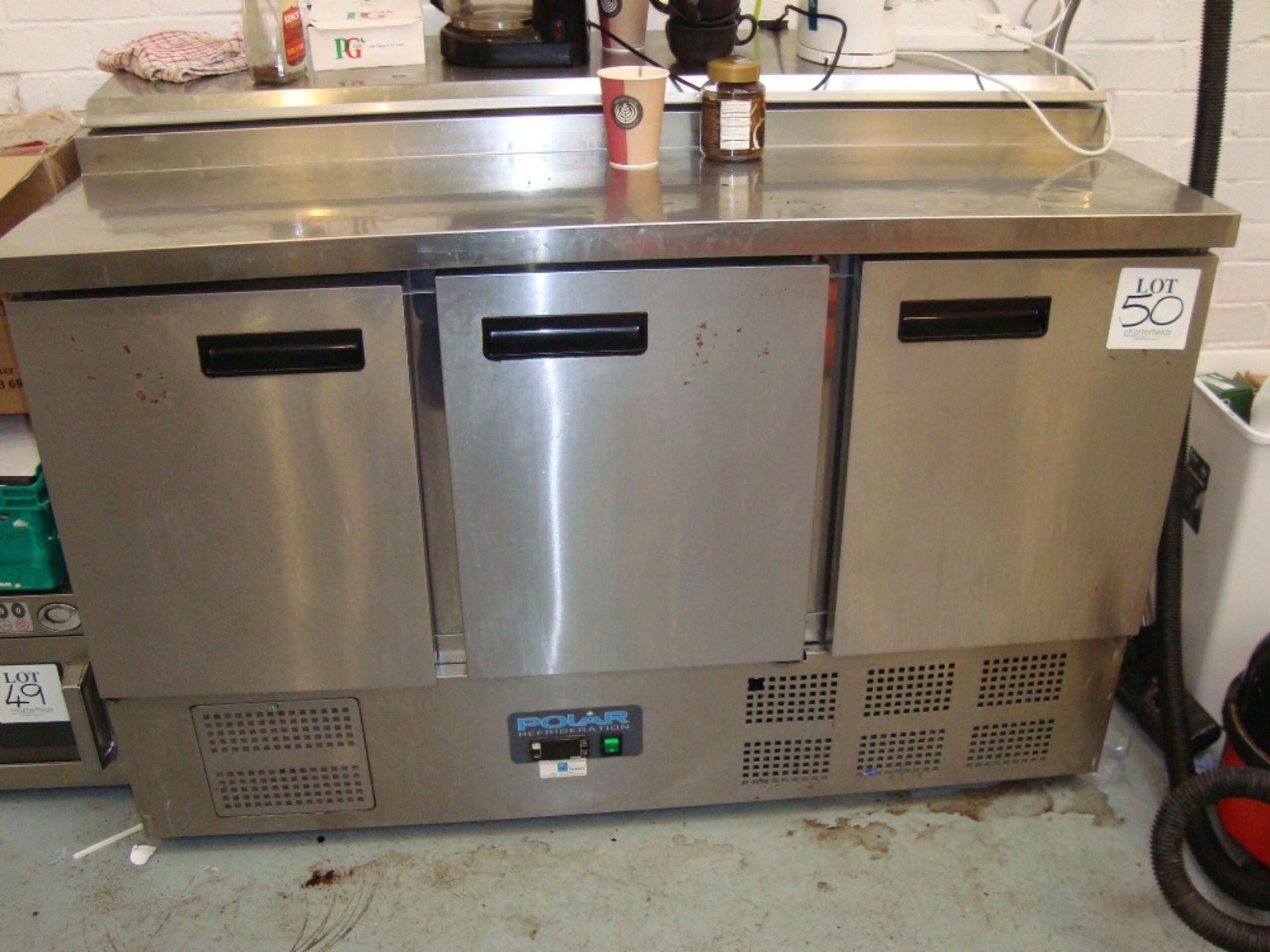 A Polar G605 low height stainless steel three door chiller with bain marie top Serial No. 6210585