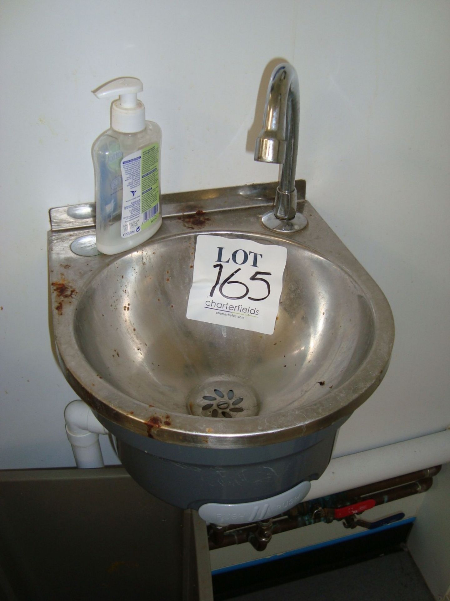 A stainless steel hand wash basin