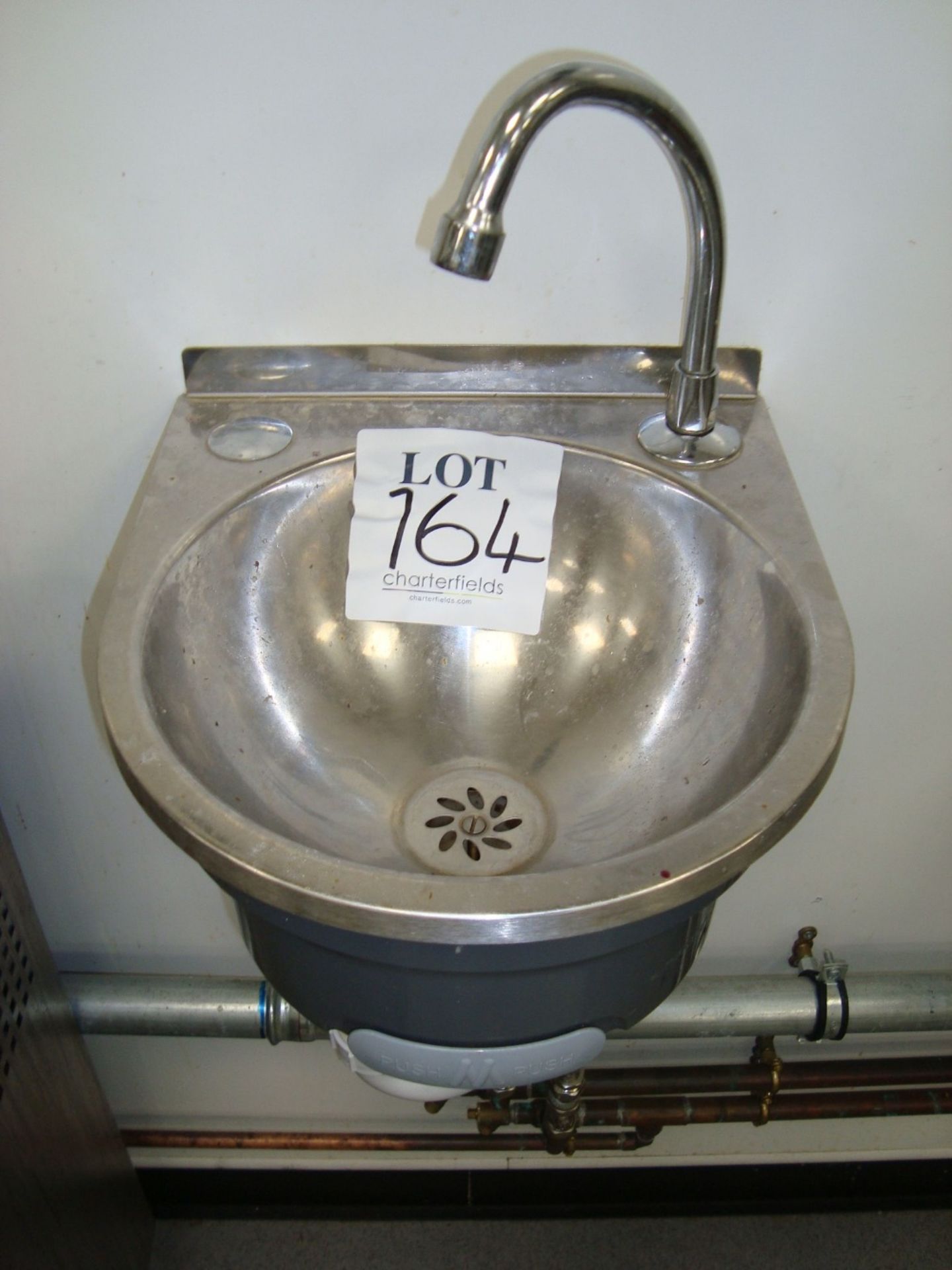 A stainless steel hand wash basin