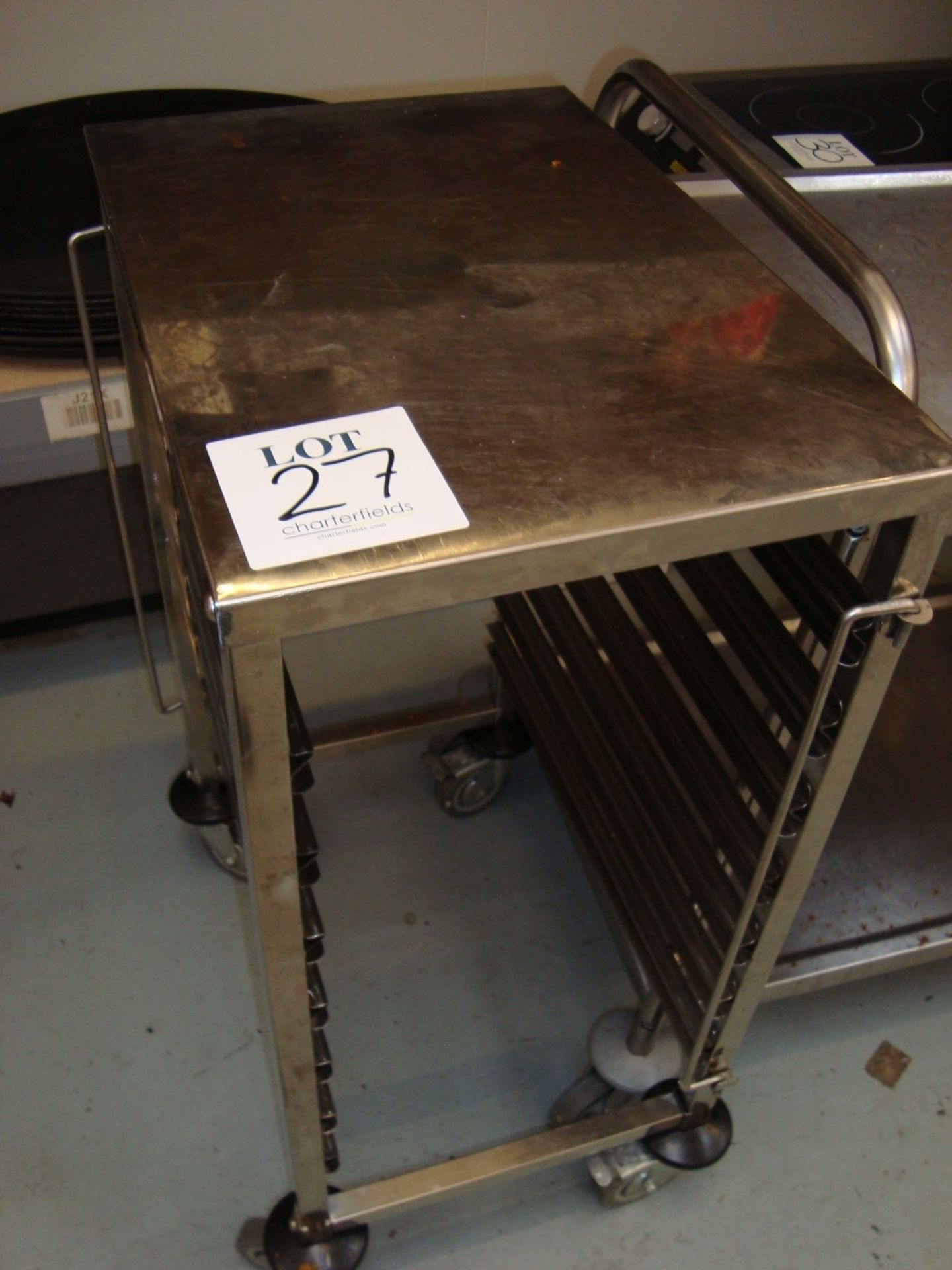 Two low height stainless steel mobile tray racks