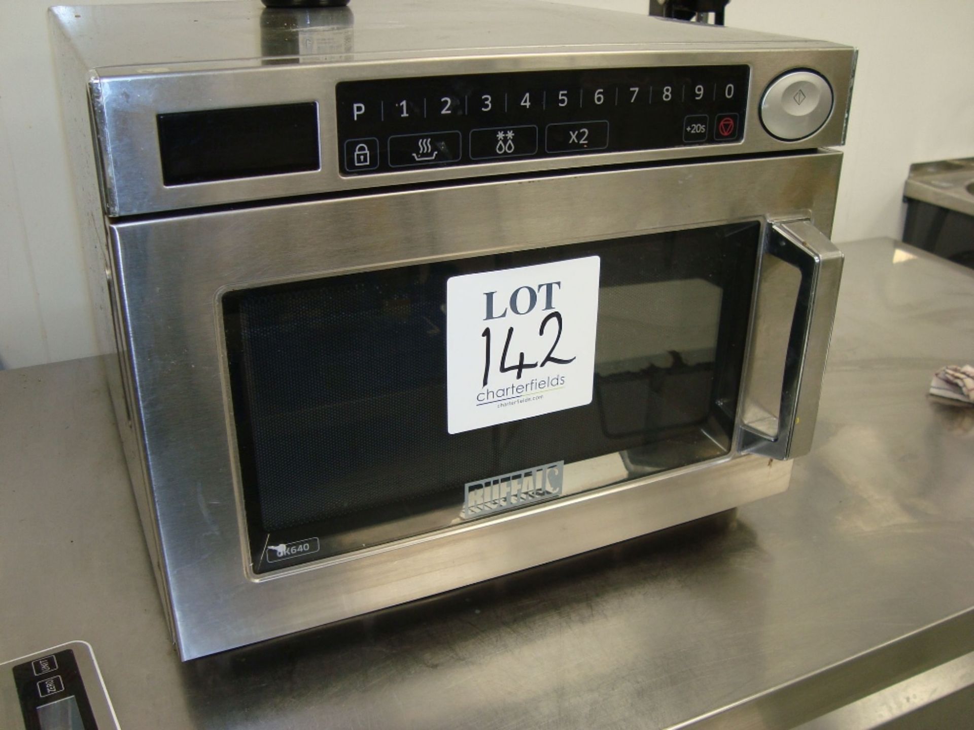 A Buffalo stainless steel commercial microwave oven