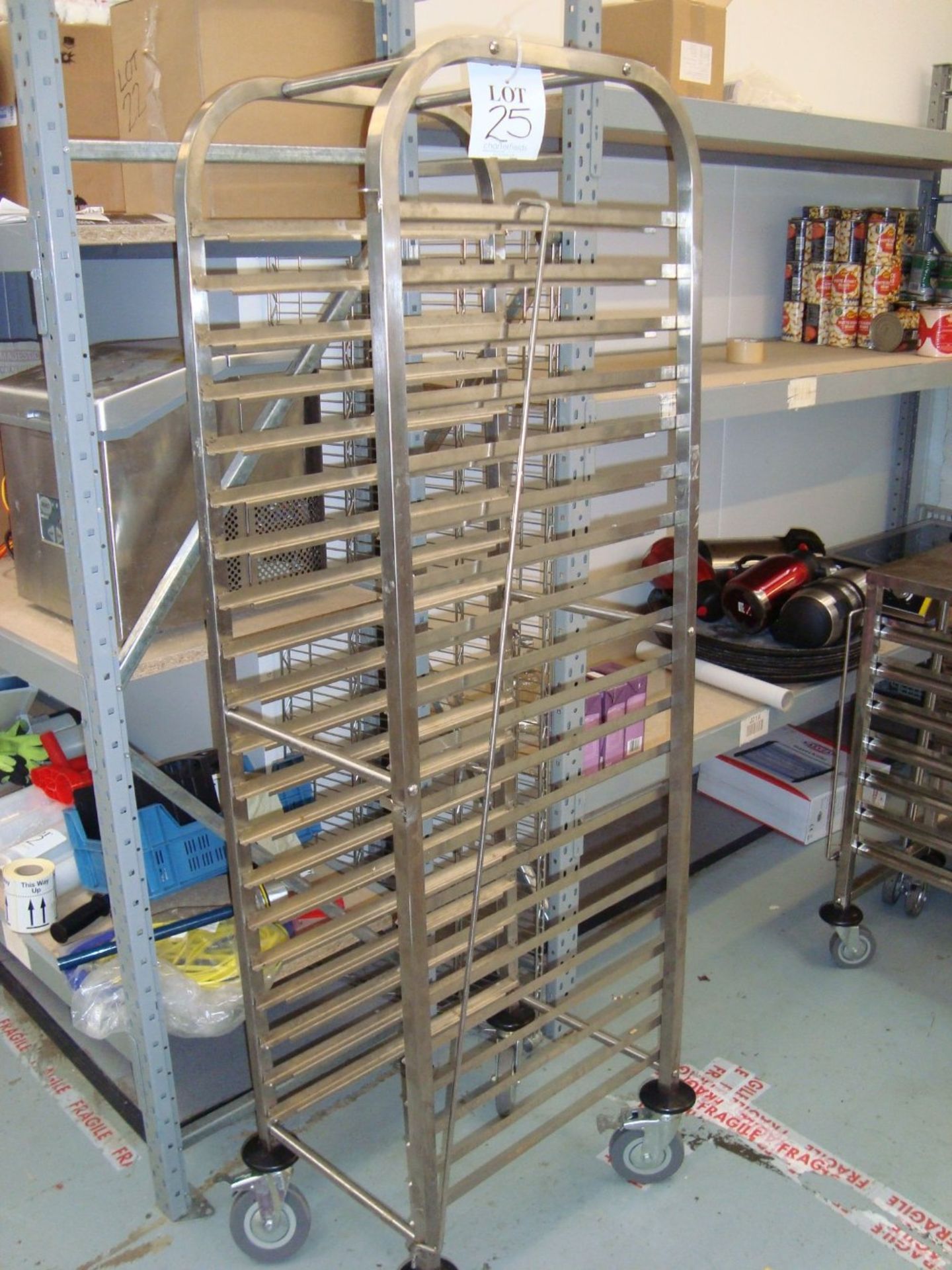 A mobile full height stainless steel tray rack