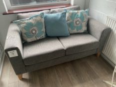 Grey cloth upholstered two seat sofa with three cushions, approximate size 162cm wide x 90cm deep