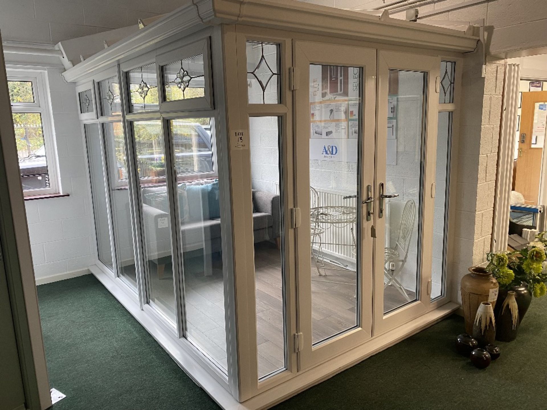 White upvc glazed corner conservatory with French doors and roof structure, with key, approximate