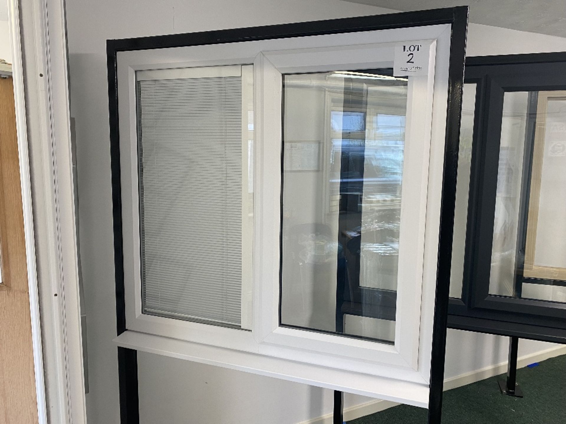 White upvc glazed window with left hand opener and one internal blind, with key, approximate size