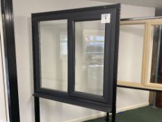 Grey upvc glazed window with left hand opener, with key, approximate size 112cm high x 120cm wide