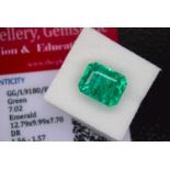 GREEN STONE WITH CARD MARKED EMERALD