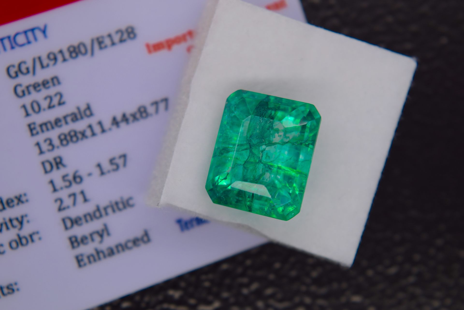 GREEN STONE WITH CARD MARKED EMERALD