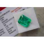 GREEN STONE WITH CARD MARKED EMERALD