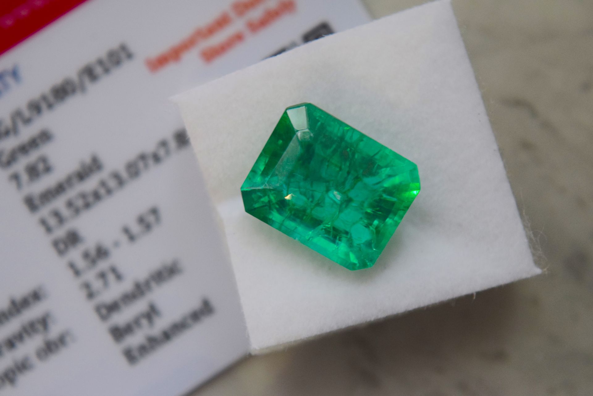 GREEN STONE WITH CARD MARKED EMERALD