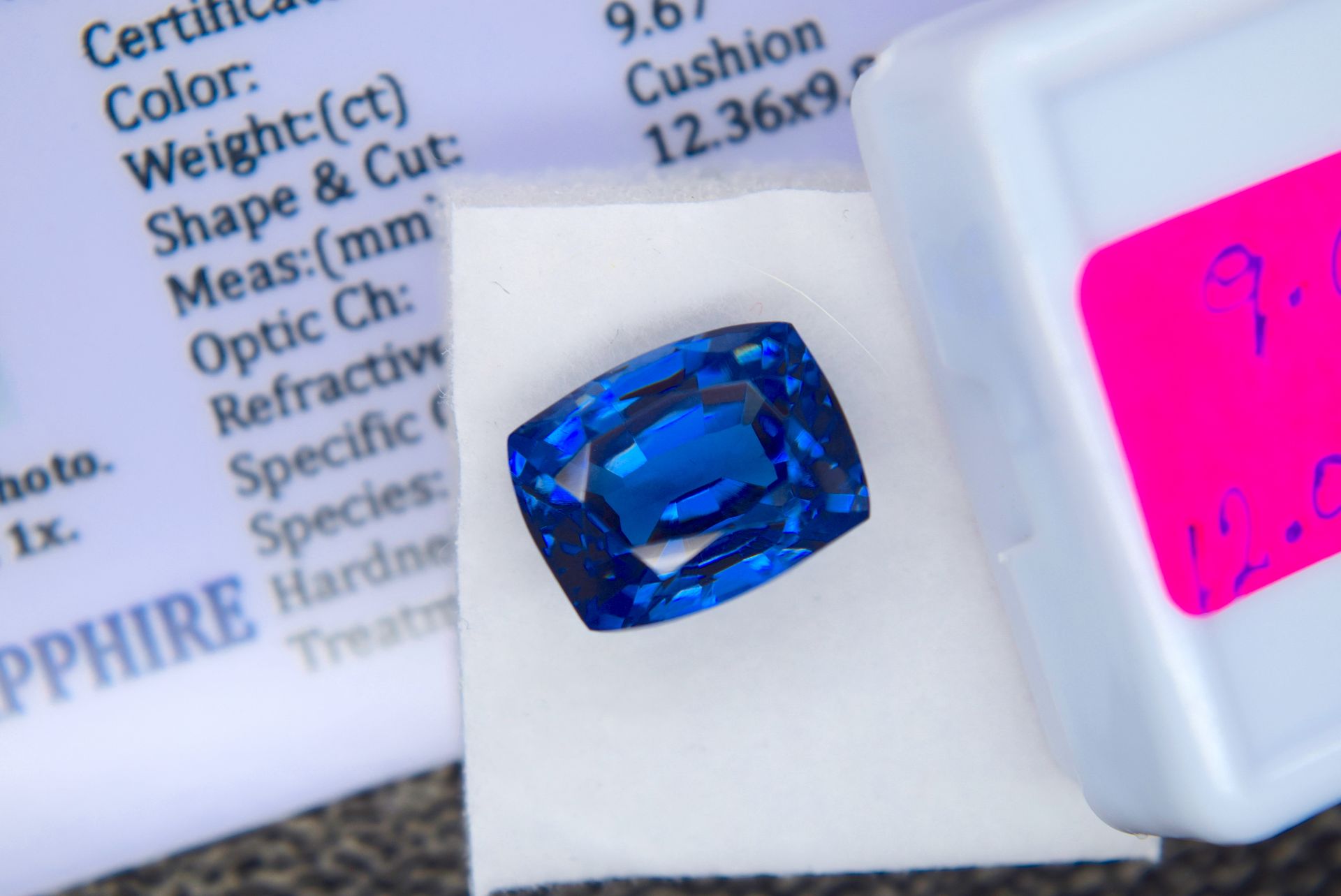 BLUE STONE WITH CARD MARKED SAPPHIRE