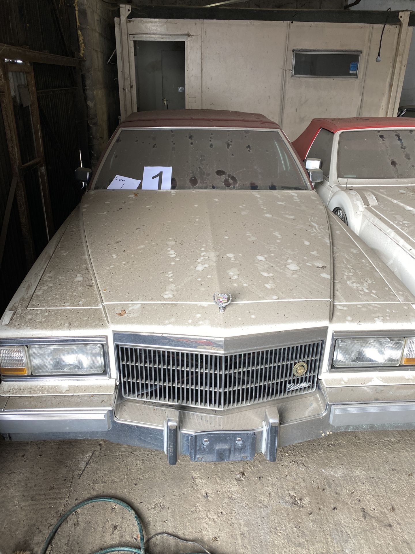 APPROX 1991 CADILLAC BROUGHAM 4 DOOR CONVERTIBLE IN WHITE WITH KEYS