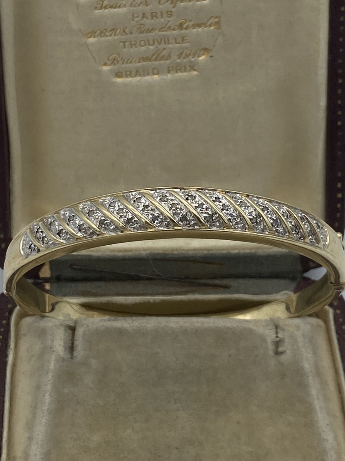 9ct GOLD DIAMOND SET BANGLE