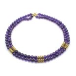 Kette mit 2 Reihen Amethystkugel. Schloß und Einsätze aus 585er Gold