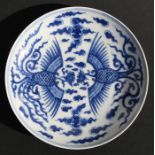 A Chinese blue & white shallow dish decorated with a phoenix amongst clouds, six character blue mark