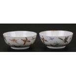 A pair of Chinese porcelain wine cups decorated with butterflies, four character red mark to the