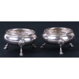 A pair of Victorian silver open salts standing on three legs, London 1856. 7cm ( 2.75 ins) diameter.