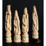 Four 19th century Japanese ivory figures in the form of Kannon on lotus bases, each 18cms (7ins)