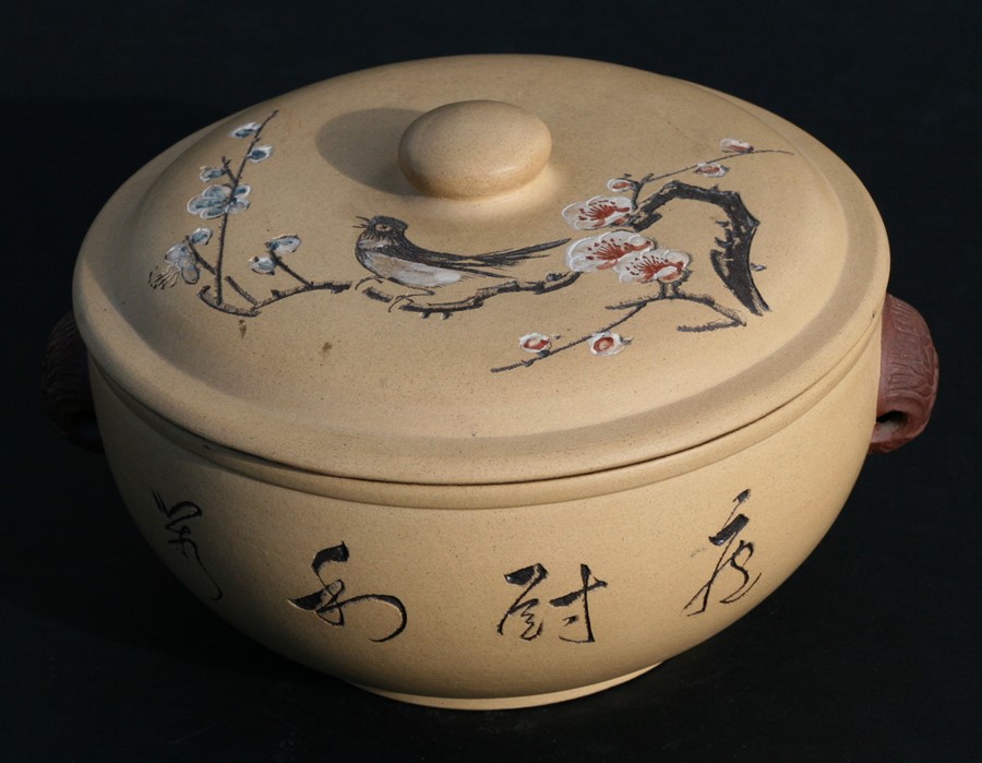A Chinese Yixing pot and cover decorated with a bird amongst prunus, with calligraphy to the side,