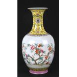 A Chinese Republic famille rose vase decorated with pomegranates, red seal mark to the underside,