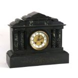 A Victorian black slate mantle clock fitted with an 8-day movement striking on a gong, 38cms (15ins)