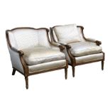 A pair of French silk upholstered armchairs.