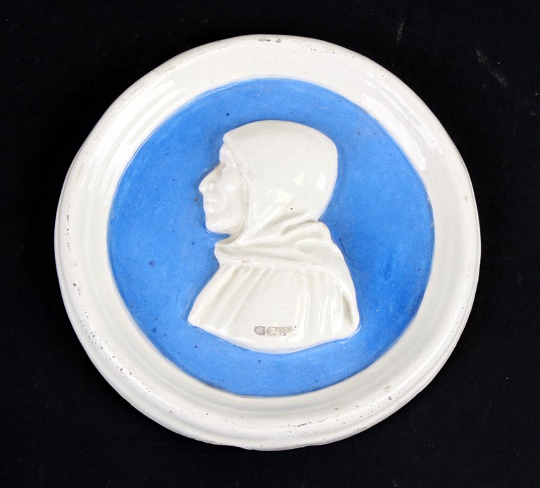 A Della Robbia faience style pottery plaque depicting Girolamo Savonarola, 13cms (5ins) diameter.