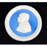 A Della Robbia faience style pottery plaque depicting Girolamo Savonarola, 13cms (5ins) diameter.