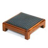 A Gordon Russell Arts & Crafts oak footstool with upholstered drop-in seat, copper plaque to the