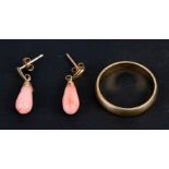 An 18ct gold wedding band, weight 3g; together with a pair of 9ct gold coral drop earrings.