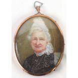 Victorian school, an oval bust portrait depicting an old lady wearing a black dress, watercolour,