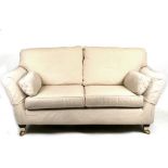 A country house style three-seat upholstered sofa.