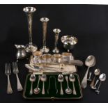 A set of three graduated silver stem vases; together with a boxed set of silver teaspoons and